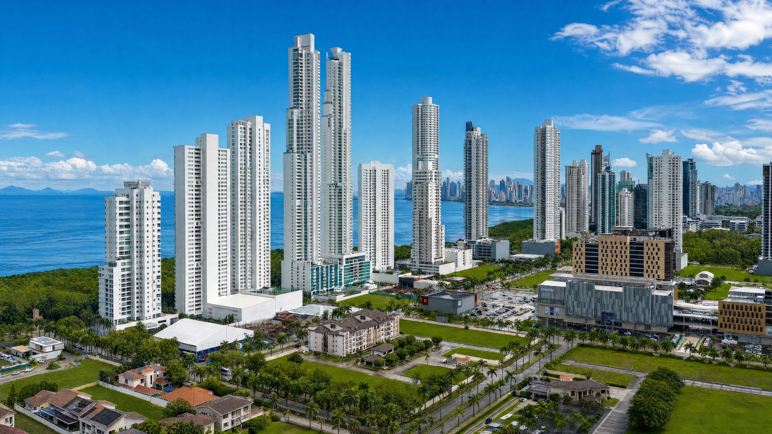 Aerial view of Costa del Este in Panama City, master-planned residential neighbourhood with mid-rise apartments, palm-lined boulevards and low-rise villas.