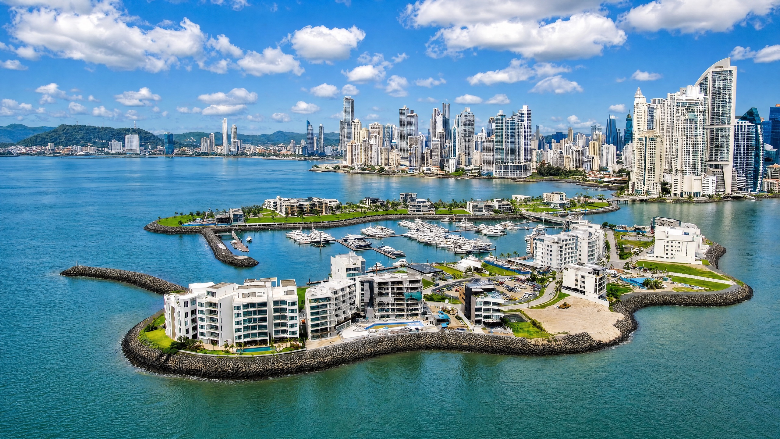 Aerial view of the Ocean Reef reclaimed islands off Punta Pacifica in Panama City, luxury high-rise condominium towers and waterfront garden apartments facing the Pacific Ocean.