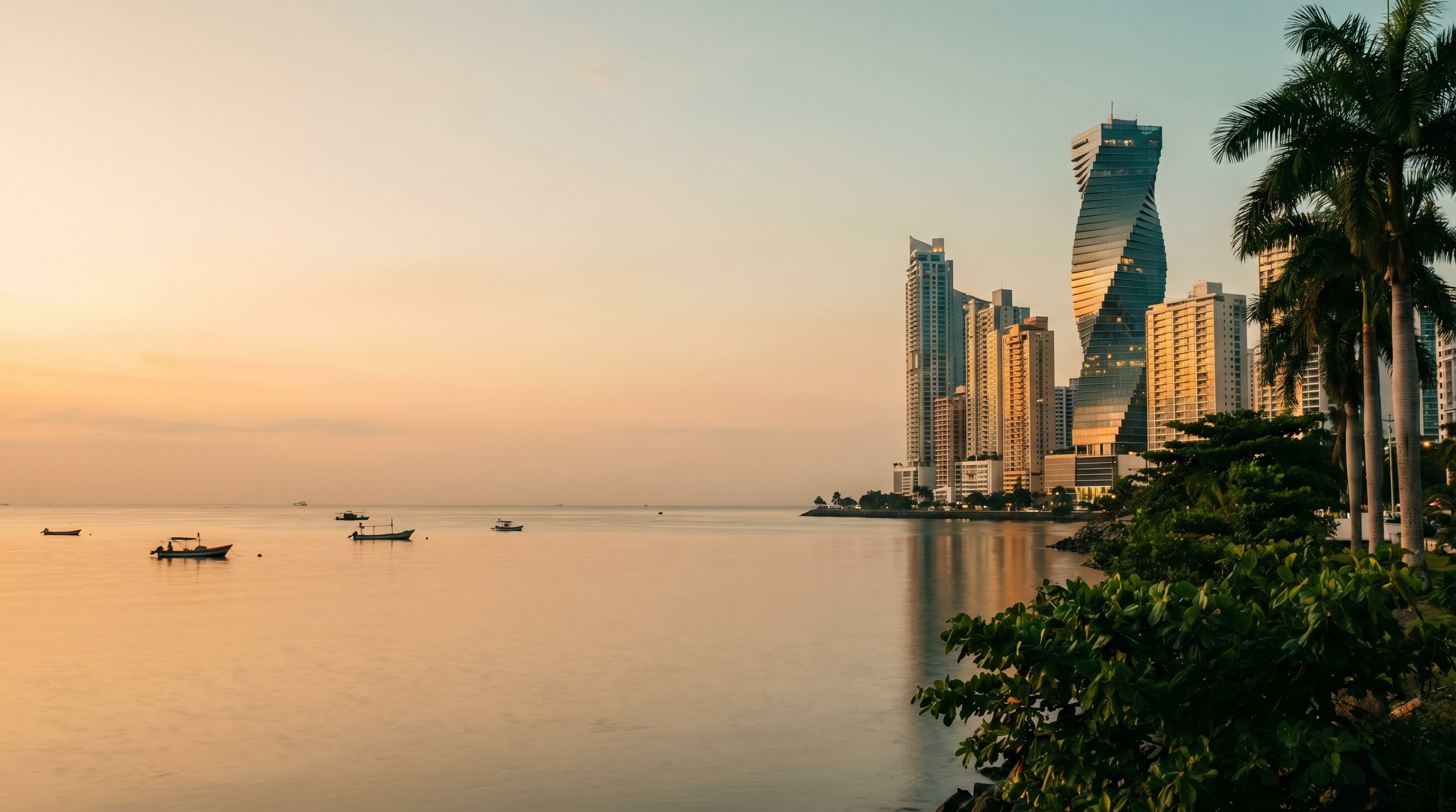 Panama City skyline at golden hour, viewed across the bay.